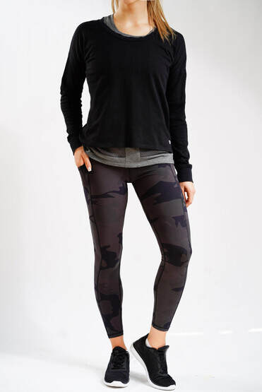 Alexo Women's 7/8 Concealed Carry Leggings in Dark Night Camo shown with outfit